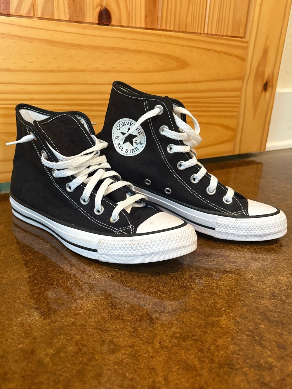 Converse high top sneakers.